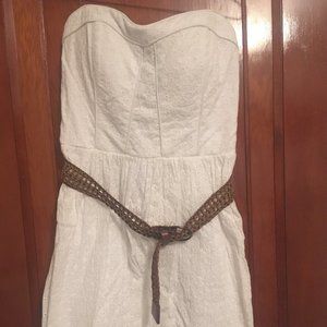 White Juniors Strapless Short dress with brown belt.